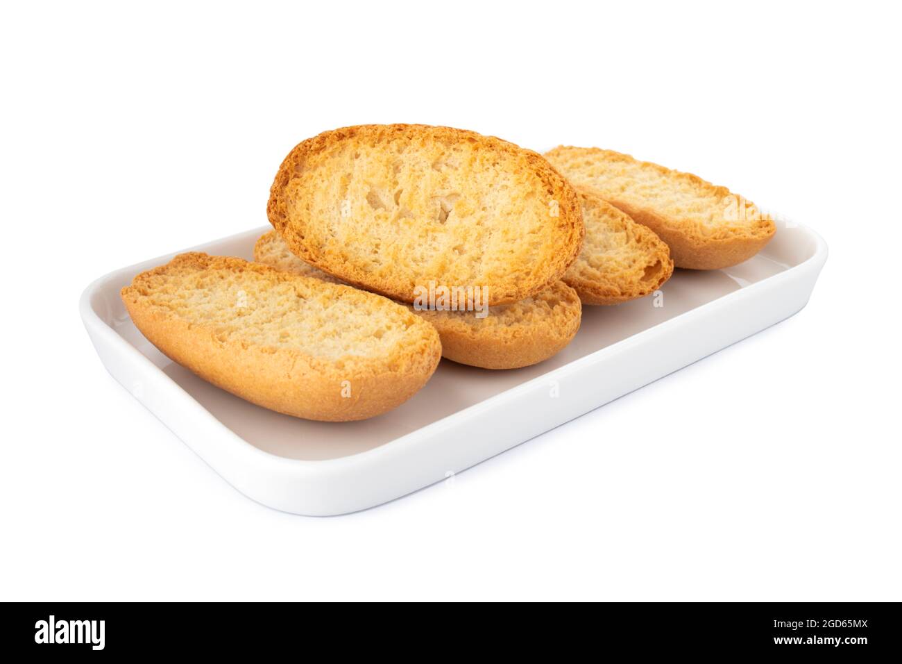 Knusprige Biscottes, französisches Toastbrot auf weißem Teller, auf weißem Hintergrund Stockfoto