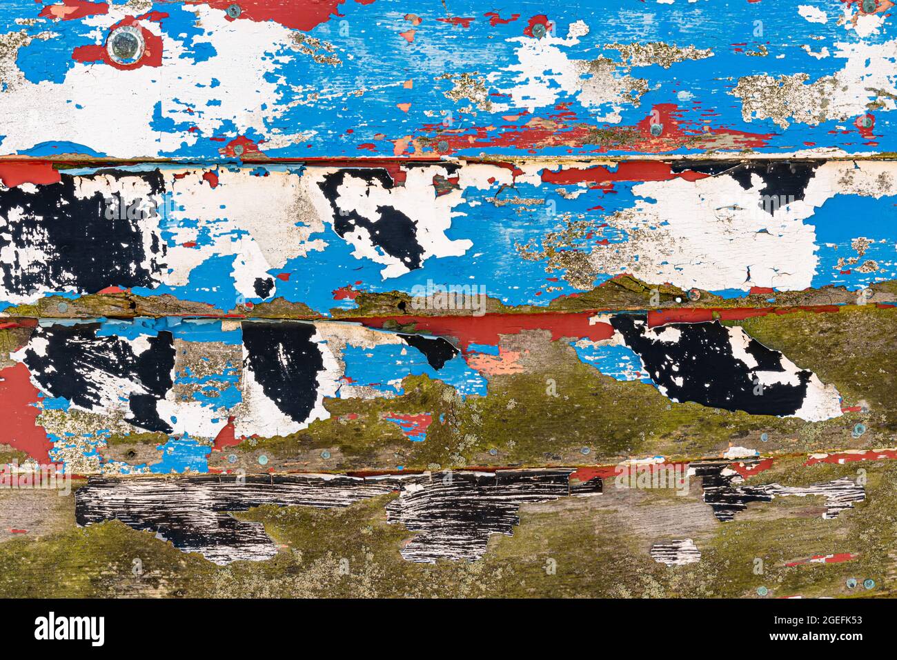 Mehrere Schichten abblätternder Farbe auf Holz Stockfoto