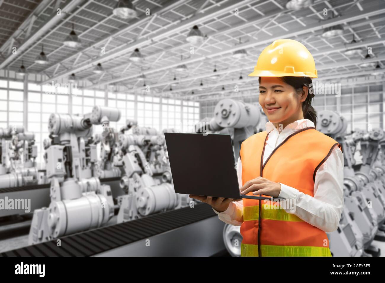 Techniker oder Techniker arbeiten im Werk mit 3d-Rendering-Roboterarmen Stockfoto