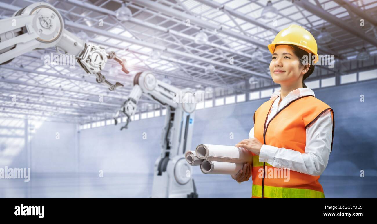 Techniker oder Techniker arbeiten im Werk mit 3d-Rendering-Roboterarmen Stockfoto