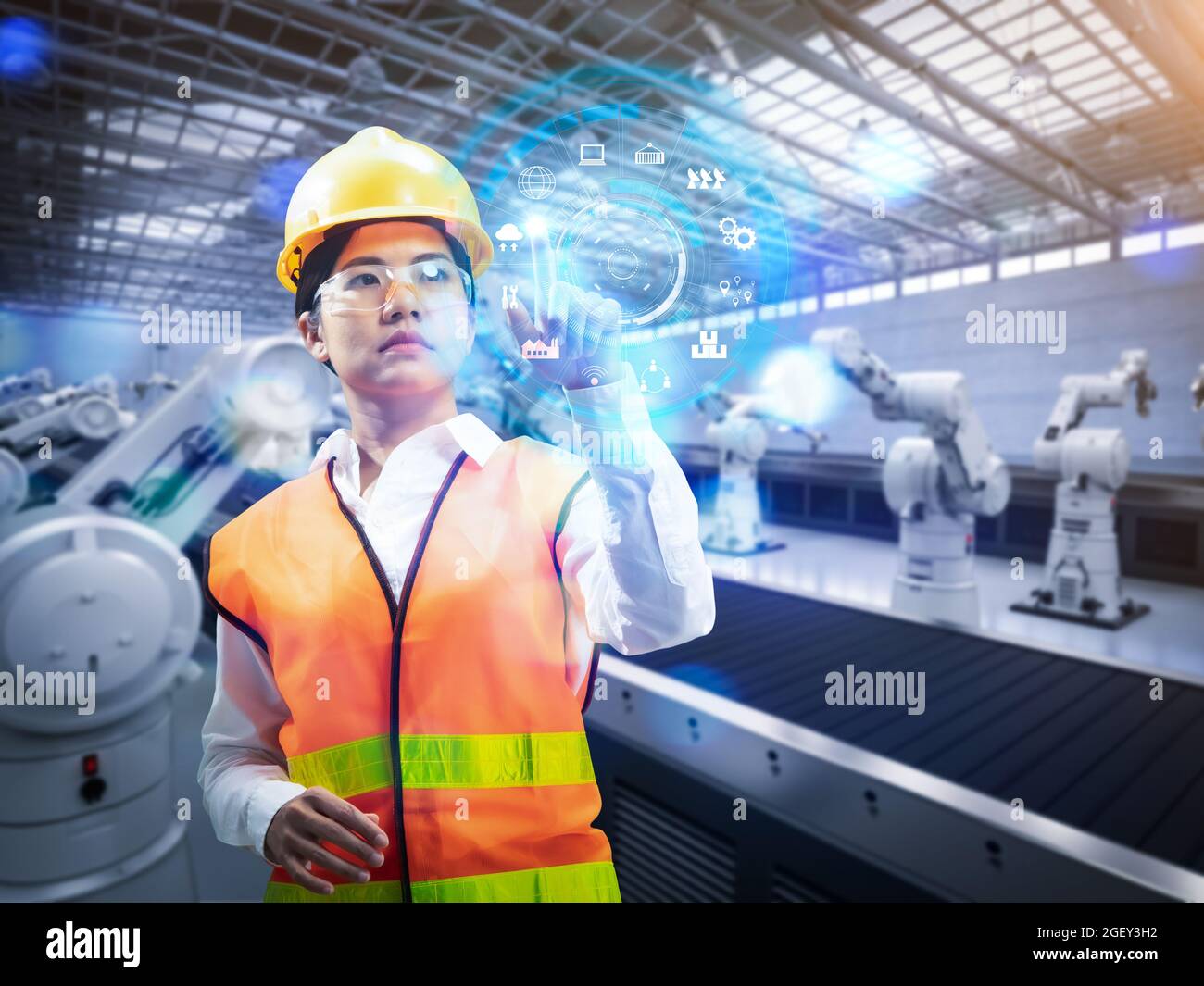 Techniker oder Techniker arbeiten im Werk mit 3d-Rendering-Roboterarmen Stockfoto