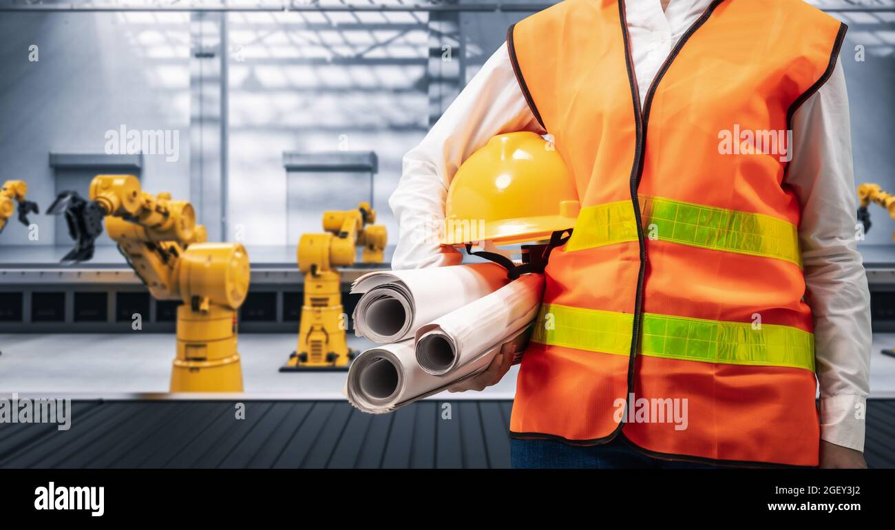 Techniker oder Techniker arbeiten im Werk mit 3d-Rendering-Roboterarmen Stockfoto
