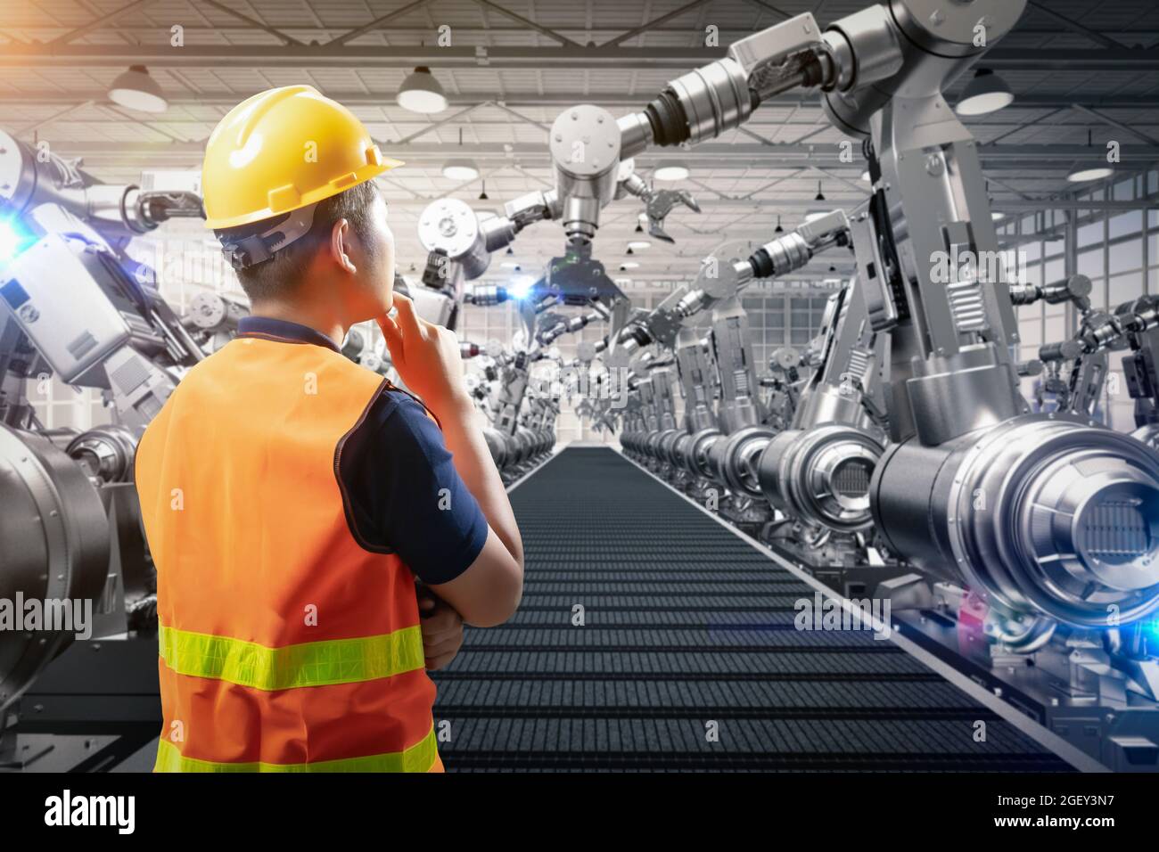 Techniker oder Techniker arbeiten im Werk mit 3d-Rendering-Roboterarmen Stockfoto