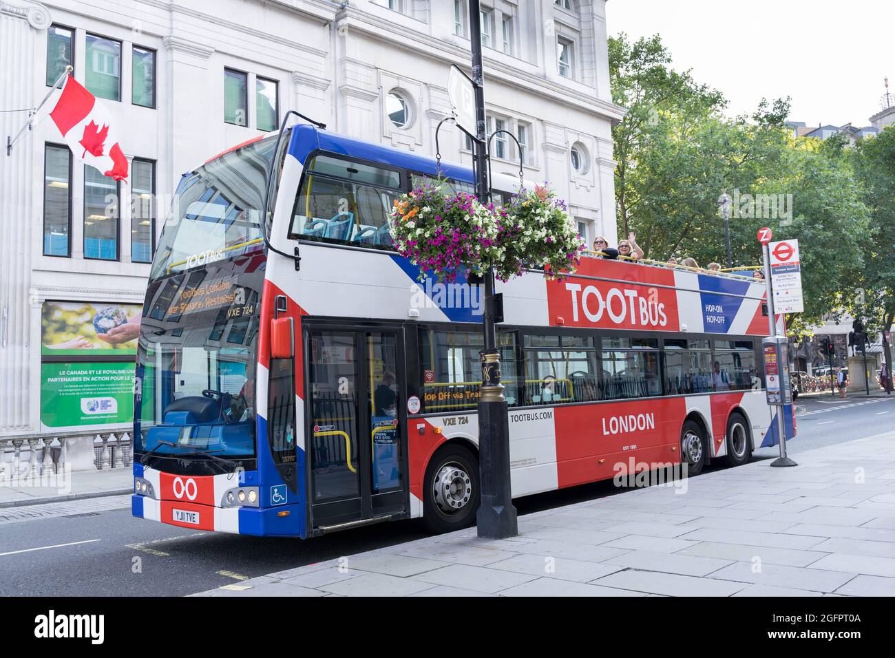 Touristen im offenen TOOT Bus Stockfoto