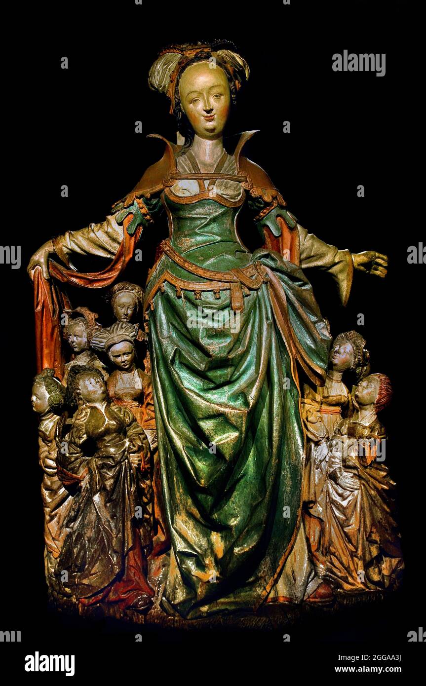 Die heilige Ursula mit ihren Jungfrauen, anonym 1525 - 1530 Niederländisch, Niederlande. ( die Tochter des christlichen Königs Ursula mit 11,000 Jungfrauen bei Köln, ermordet von den Hunnen. Wohlhabende Dame, in der Luxusmode der Renaissance gekleidet. Einige ihrer Mädchen suchen unter ihrem Mantel.) Stockfoto