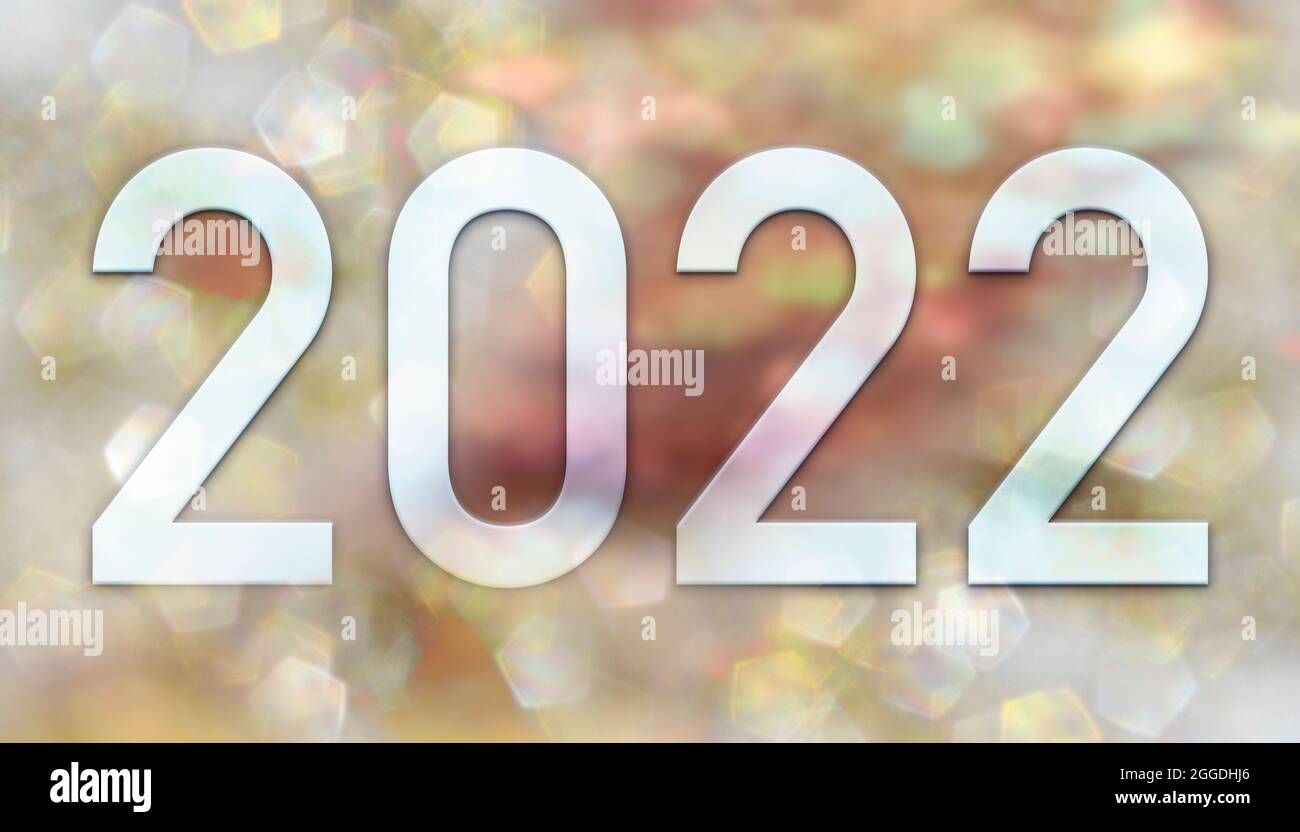 Neujahr 2022 Zahlen Auf Dem Hintergrund Eines Bildes Von Unfokussiert Glitzernden Lichtern In Gold Und Rosa Tonen Stockfotografie Alamy