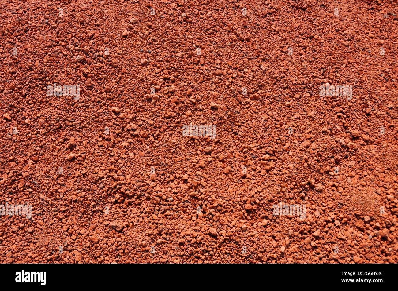 Natürlicher Hintergrund aus feinem roten Sand Stockfoto