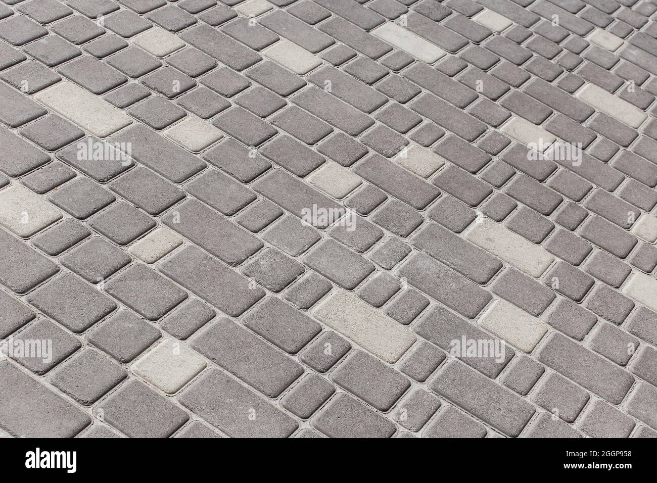 Oberfläche Stadt Boden Textur Pflaster Stein Mosaik Fliesen grau Straße Platten Hintergrund. Stockfoto