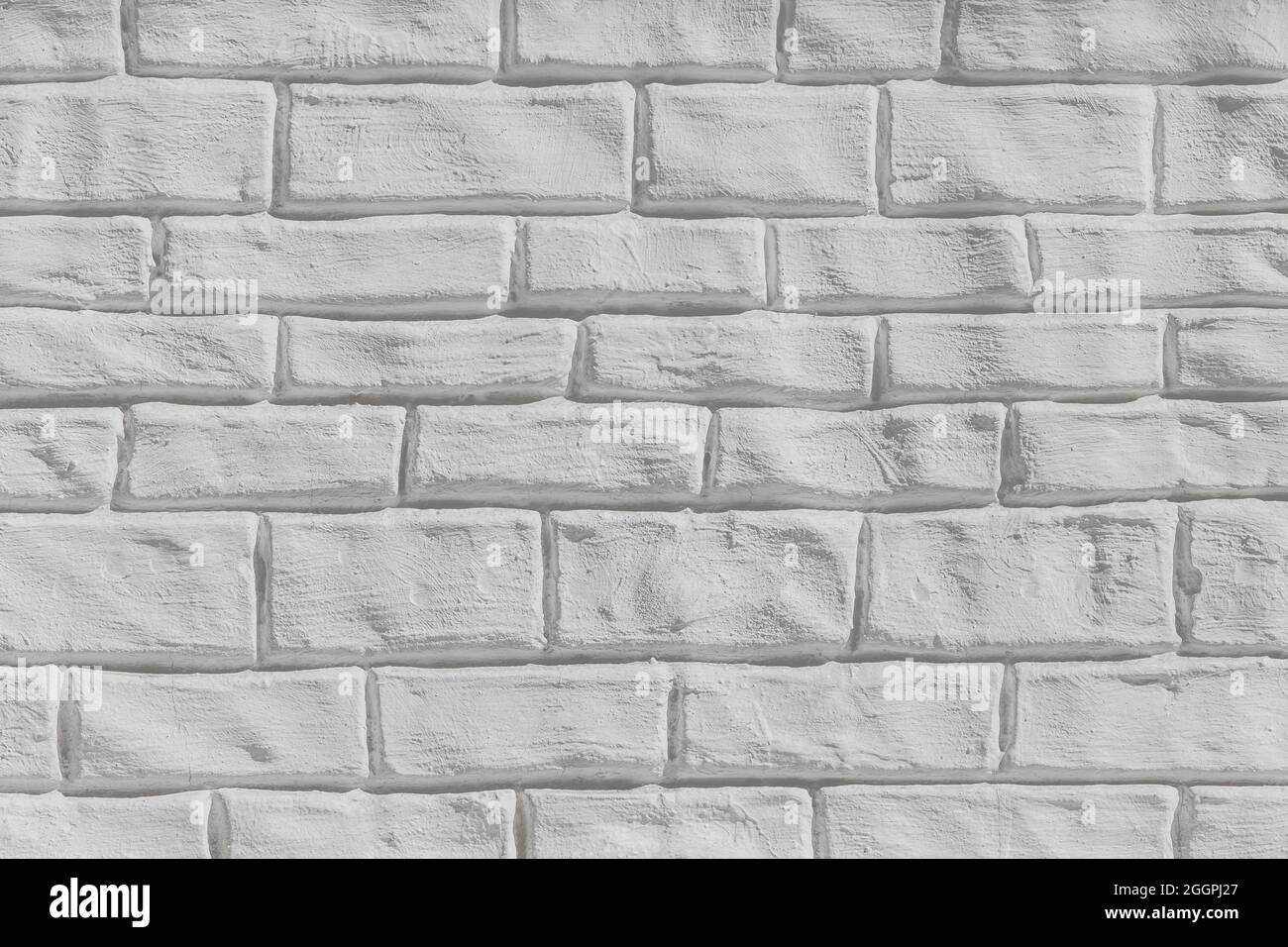 Hellgrauer oder weißer Backstein-Wand Oberflächenstruktur Hintergrund. Stockfoto