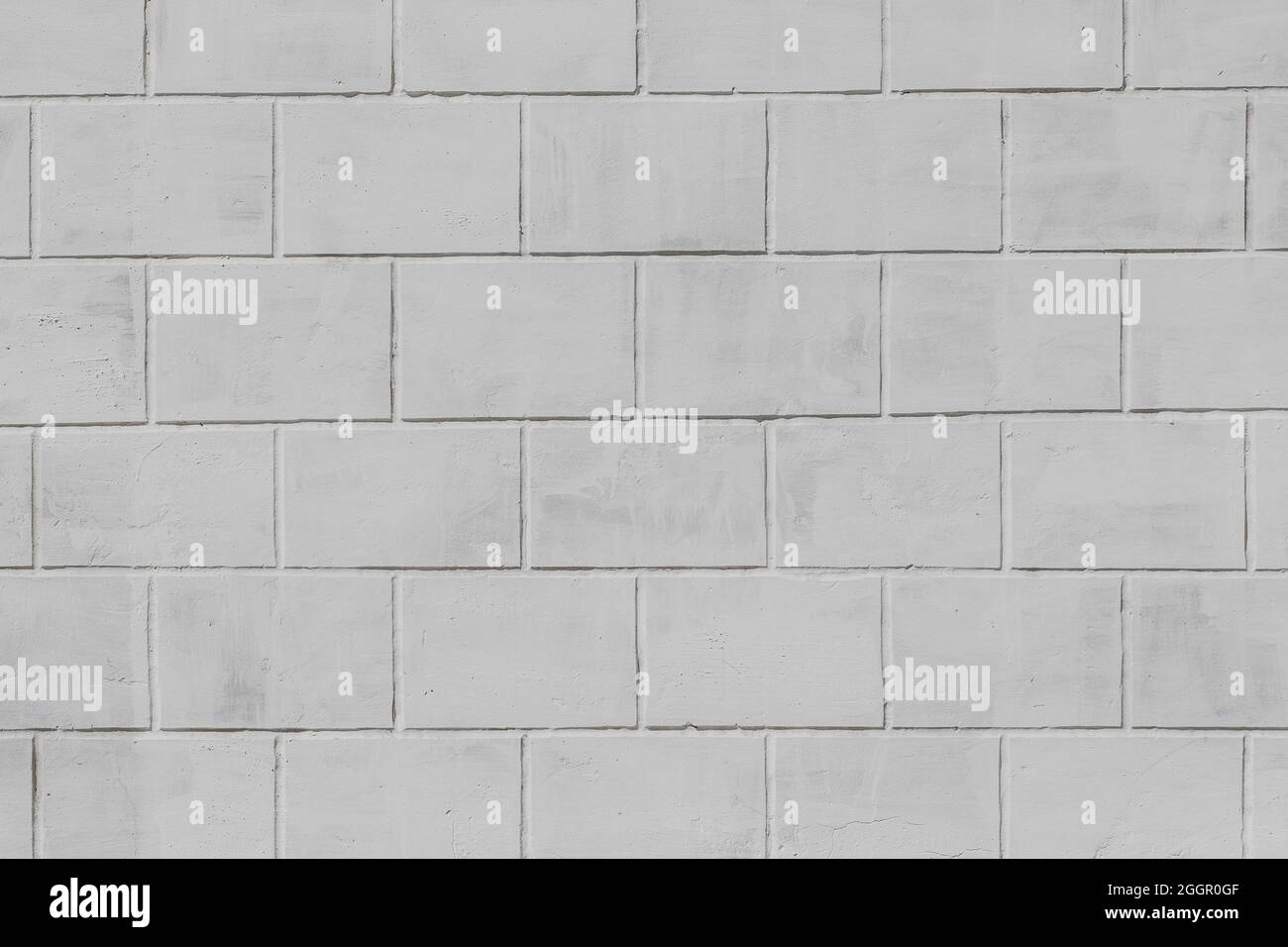 Hellgrau Backstein Block Stein Muster Oberfläche Fassade Wand Textur Hintergrund. Stockfoto