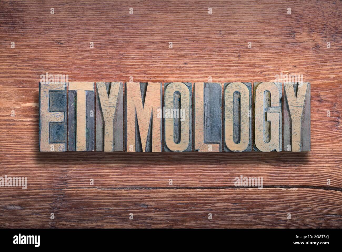 Etymologie Wort kombiniert auf vintage lackierte Holzoberfläche Stockfoto