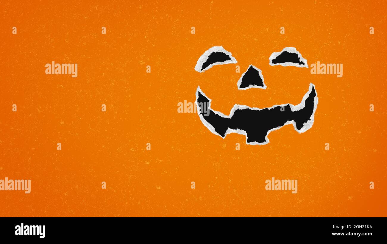 Jack-O-Lantern Hintergrund und Halloween Urlaub Kürbis als Herbst oder Herbst Saison Symbol als geschnitzte Kürbis aus zerrissenem strukturiertem Papier. Stockfoto
