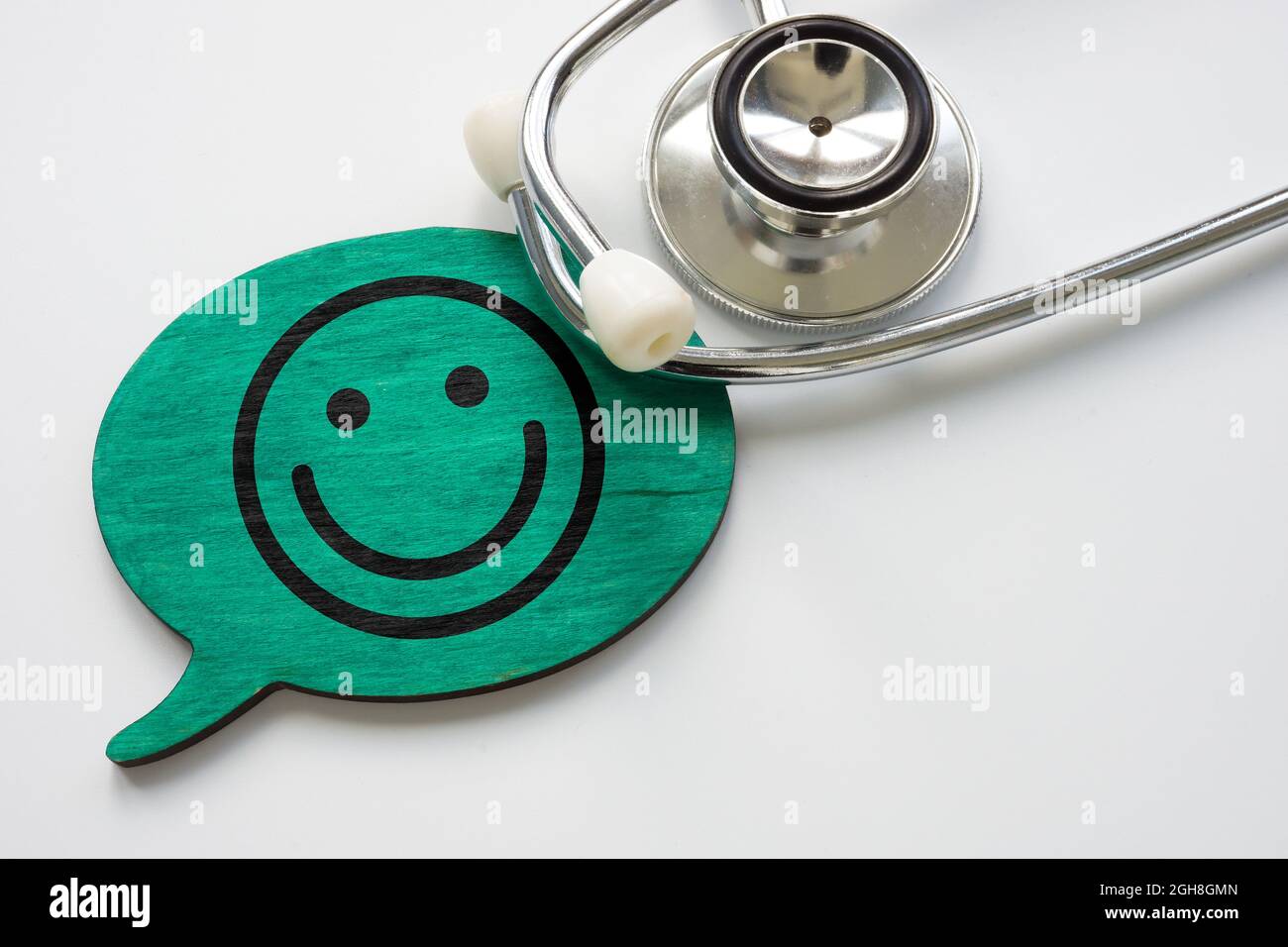 Patientenzufriedenheitskonzept. Stethoskop und Smiley-Gesicht. Stockfoto