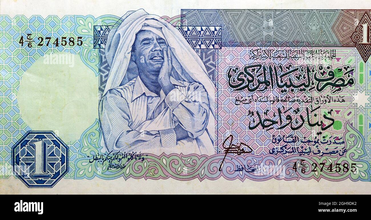 Ein großes Fragment der obversen Seite von 1 eine libysche Dinar-Banknotenwährung, die von der libyschen Zentralbank mit dem Bild von Muammar al-Ghaddafi im Wert von 1988 Euro ausgegeben wurde, vi Stockfoto