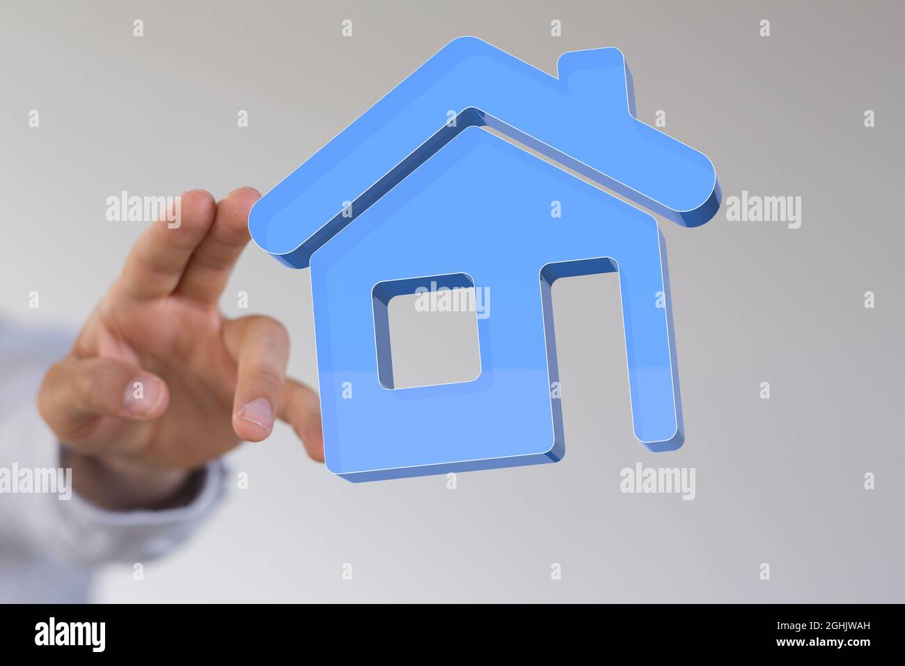 Person, die ein 3D-gerendertes Haus berührt Stockfoto