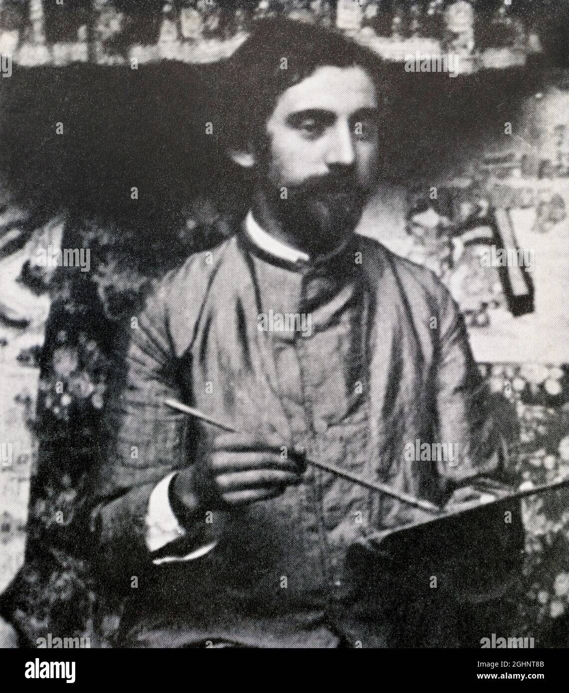Emile Henri Bernard, 1868 bis 1941, französischer Postimpressionistischer Maler und Schriftsteller, ein Pionier des Cloisonnismus und der Pont-Aven-Schule und ein Freund von Paul Gauguin und Vincent van Gogh. Fotografie von Bernard mit einem Pinsel und einer Palette. Stockfoto