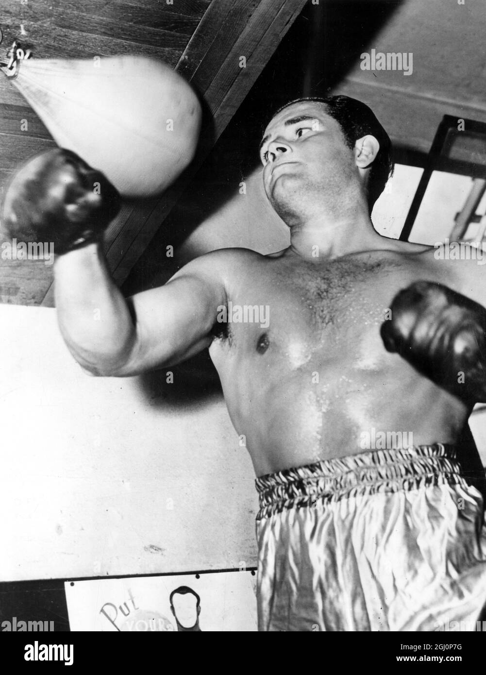 Der ehemalige Amateurboxer, der zum Schauspieler wurde, Tom Neal, wird zur Zeit seiner Ringkarriere als Trainer gezeigt. 15. September 1951 Stockfoto