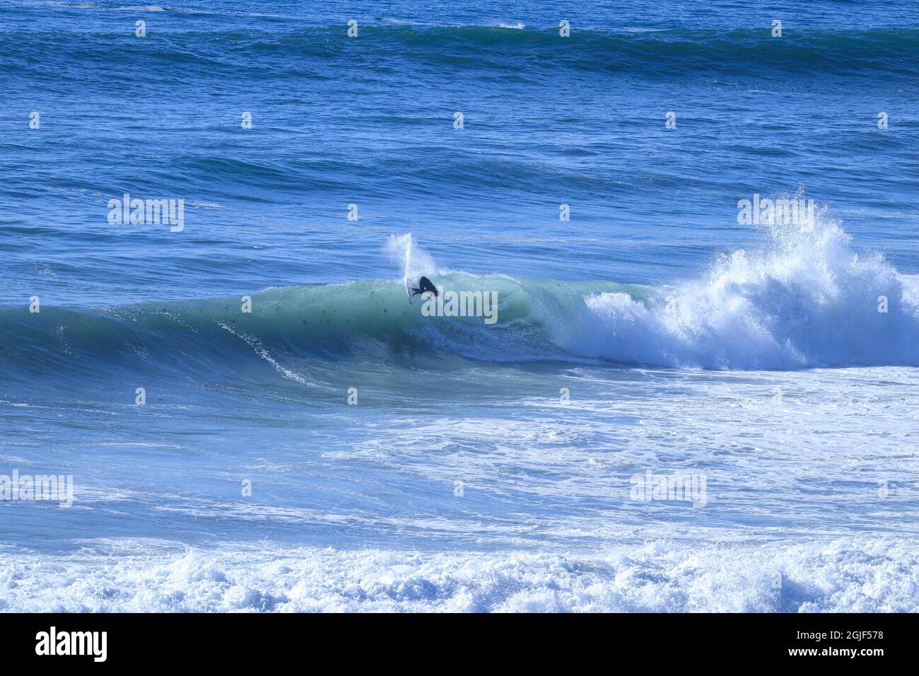 Surfer auf einer perfekten Welle Stockfoto