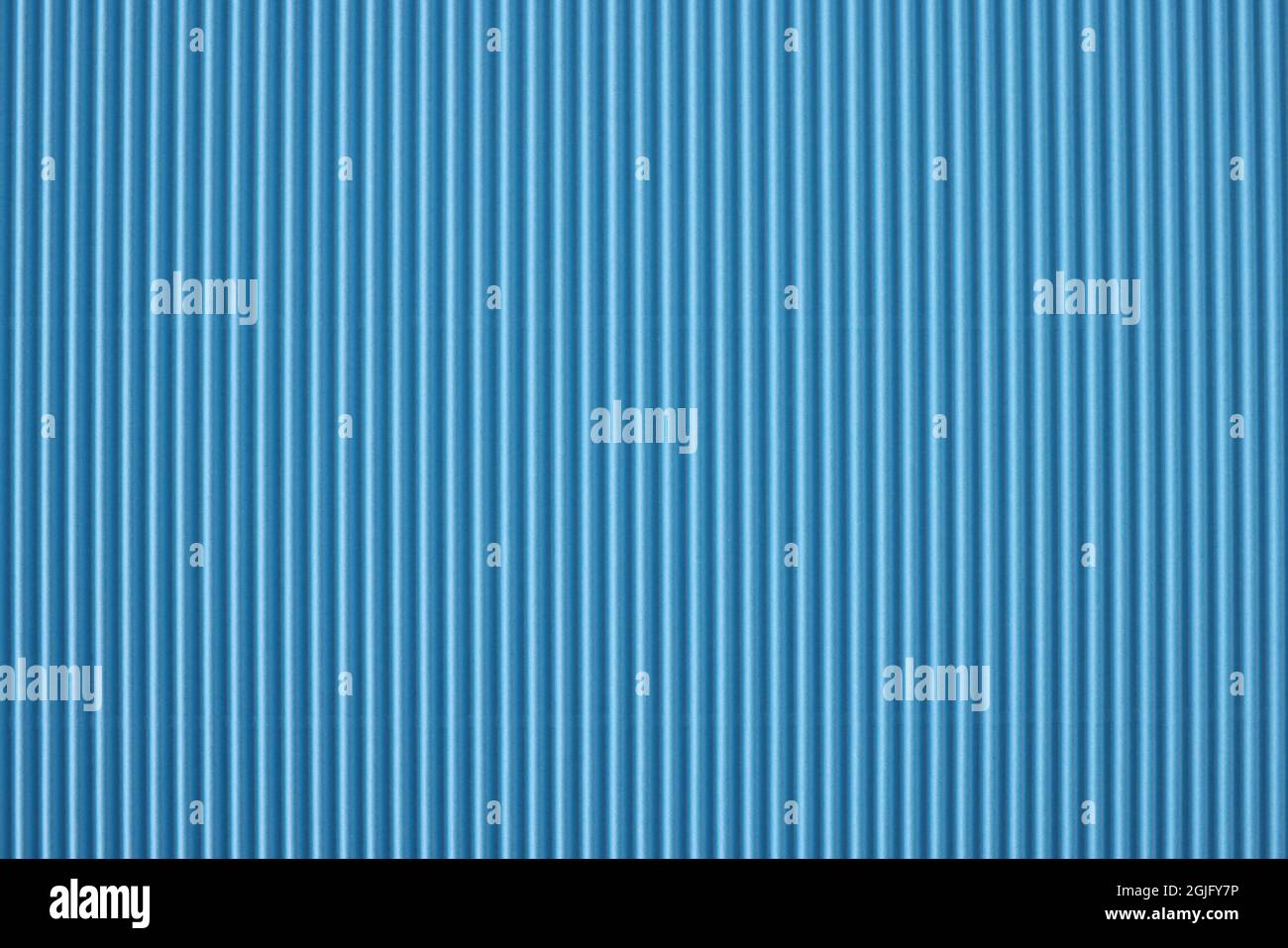 Nahaufnahme von blau gestreiftem, perforiertem Papierhintergrund Stockfoto