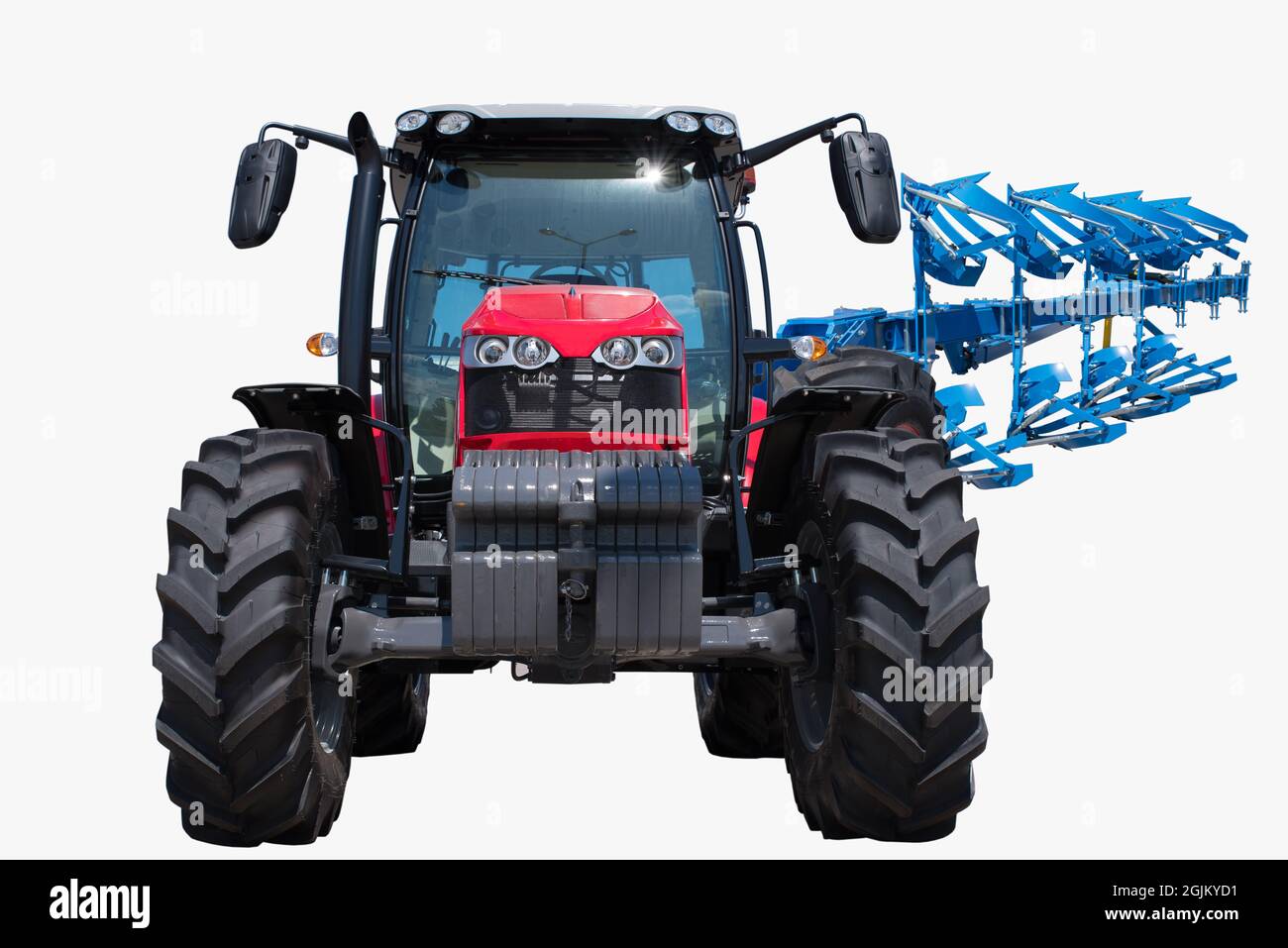 Traktor mit landwirtschaftlichem Pflug Stockfoto