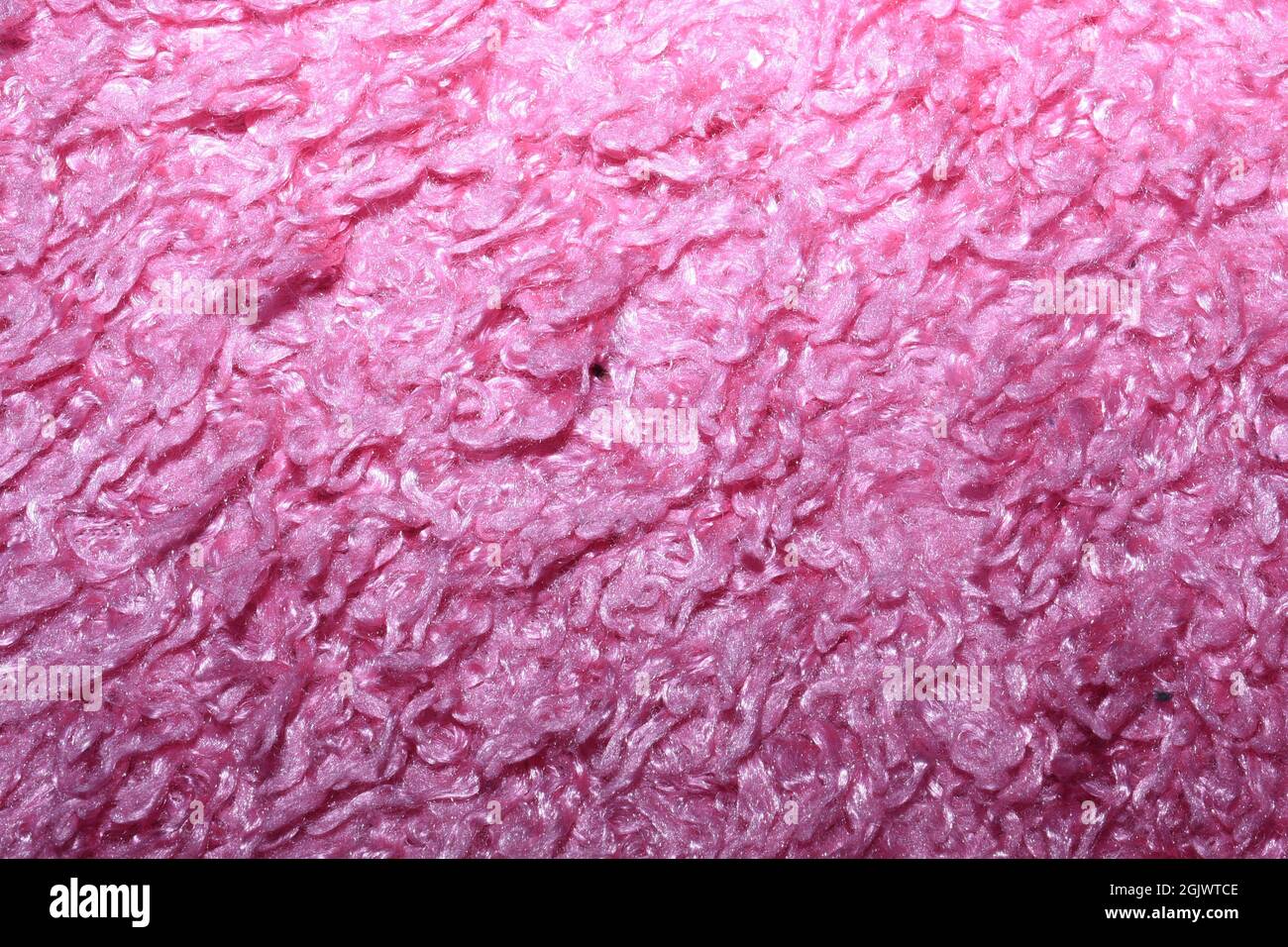 Helle, pinke Teppichstruktur. Stockfoto