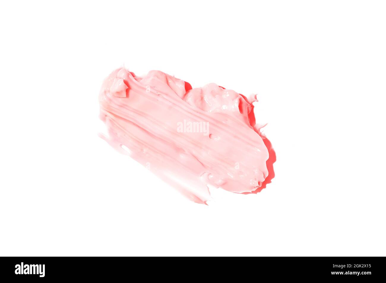 Der Abstrich und die Textur der Creme. Rosa Farbe isoliert auf weißem Hintergrund. Ein Element für kosmetisches Beauty-Design. Hochwertige Fotos Stockfoto