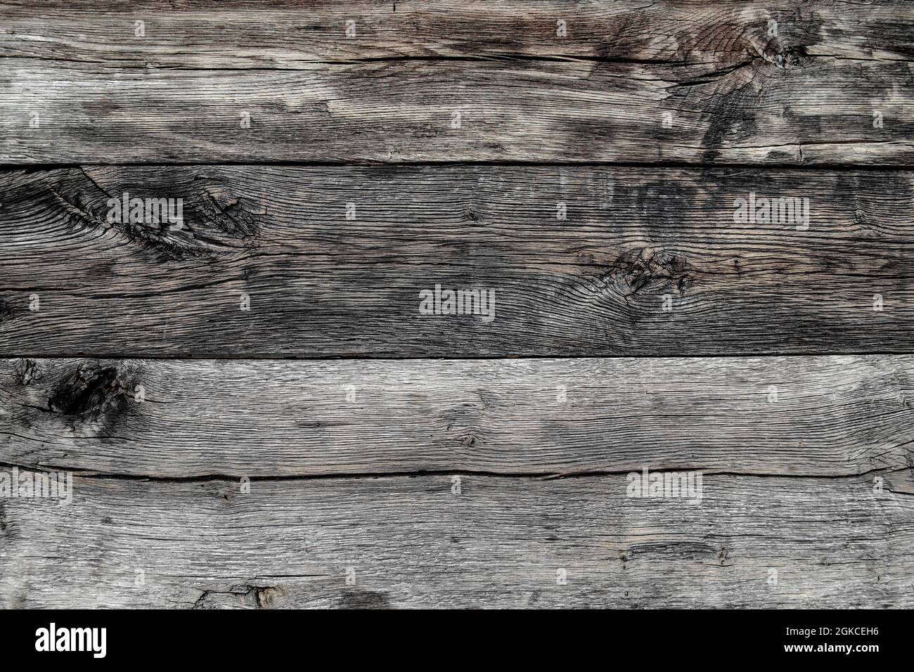 Grauer rustikaler verwitterter Holzhintergrund. Holzstruktur Stockfoto