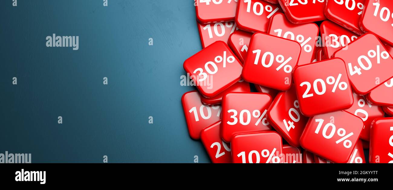 Verkaufskonzept - Rabatt von bis zu 40%. Kacheln mit unterschiedlichen Prozentwerten (10 bis 40) auf einem Haufen auf einer Tabelle. Stockfoto