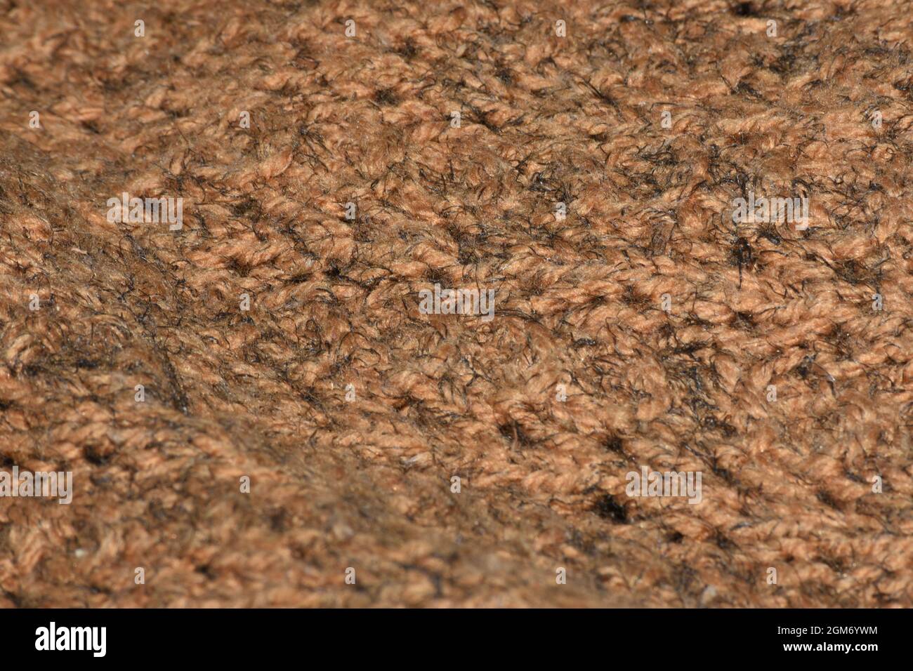 Brauner gewebter abstrakter Hintergrund mit selektivem Fokus Stockfoto