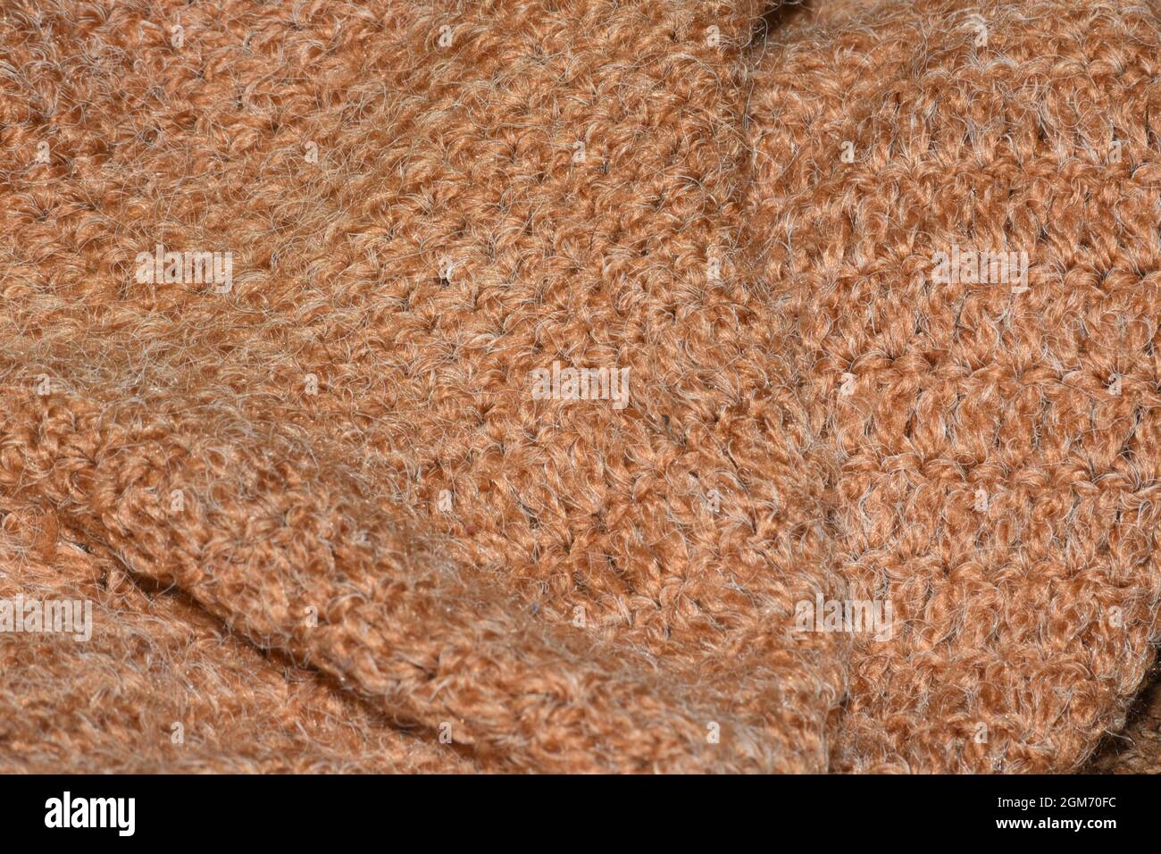 Brauner gewebter abstrakter Hintergrund mit selektivem Fokus Stockfoto