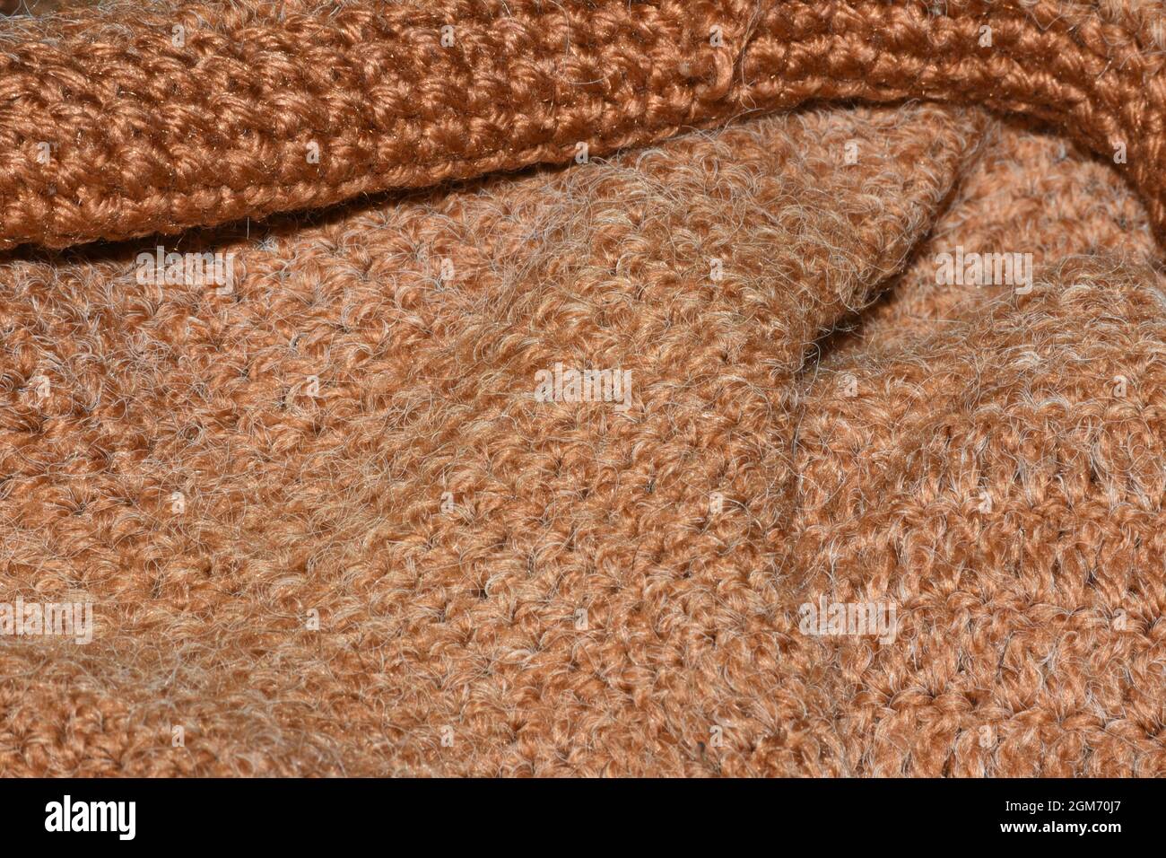 Brauner gewebter abstrakter Hintergrund mit selektivem Fokus Stockfoto