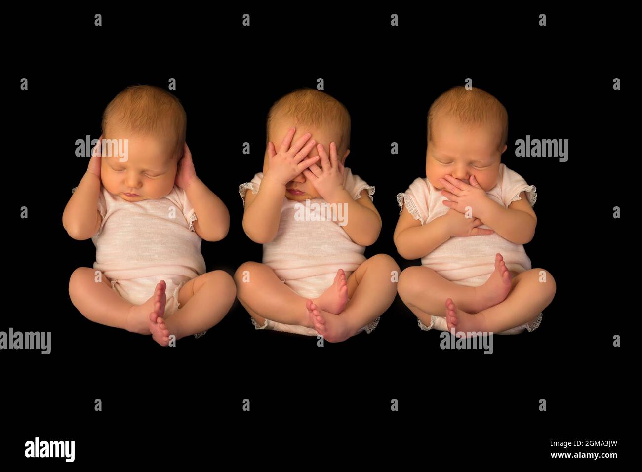 Ein Baby posiert dreimal, um dem Sprichwort zu zeigen, hören sehen, sprechen kein Böses Stockfoto