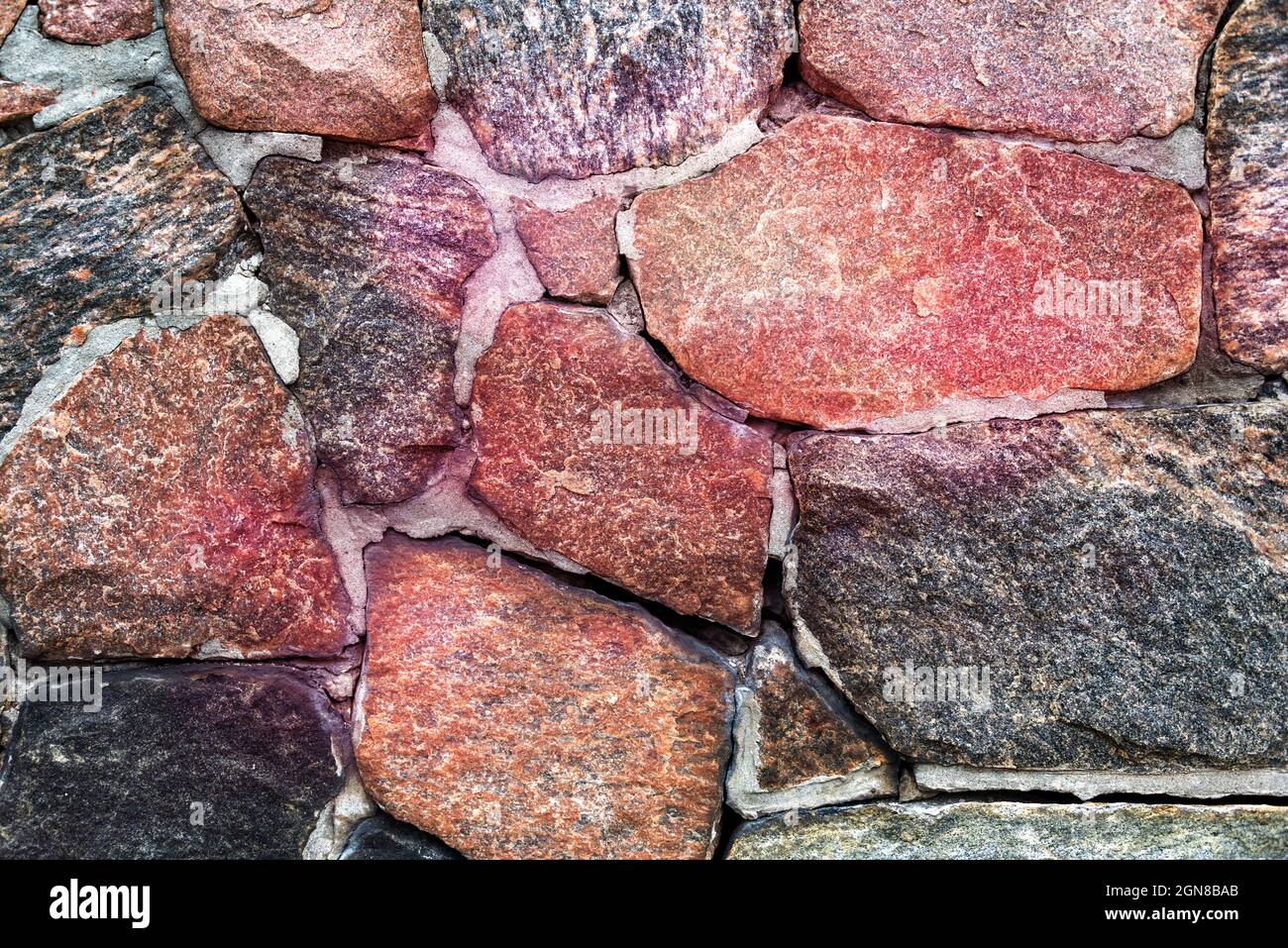 Muster aus Steinen in einer alten Wand für ein Designelement Stockfoto