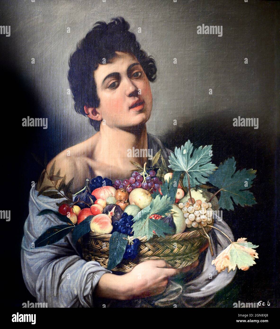Caravaggio - Junge mit einem Obstkorb Stockfoto