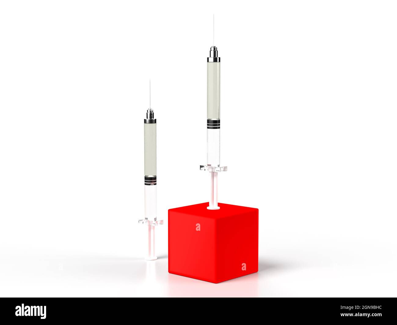 Zwei Impfspritzen, eine auf einer roten Box als Auffrischungsimpfung Stockfoto