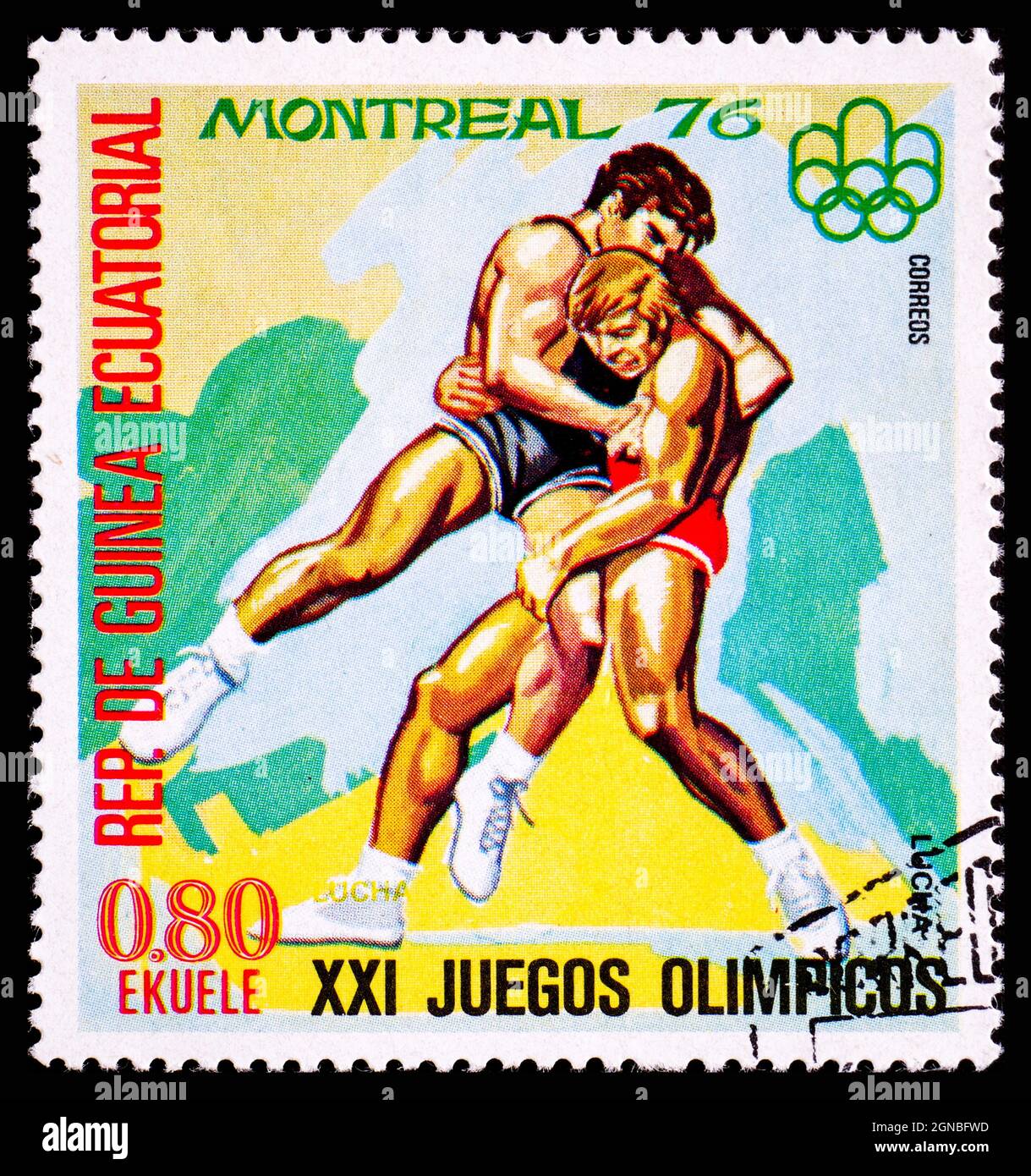 ÄQUATORIALGUINEA - UM 1976: Eine Briefmarke aus Guinea, die Wrestling bei den XXI Olympischen Spielen in Montreal zeigt Stockfoto