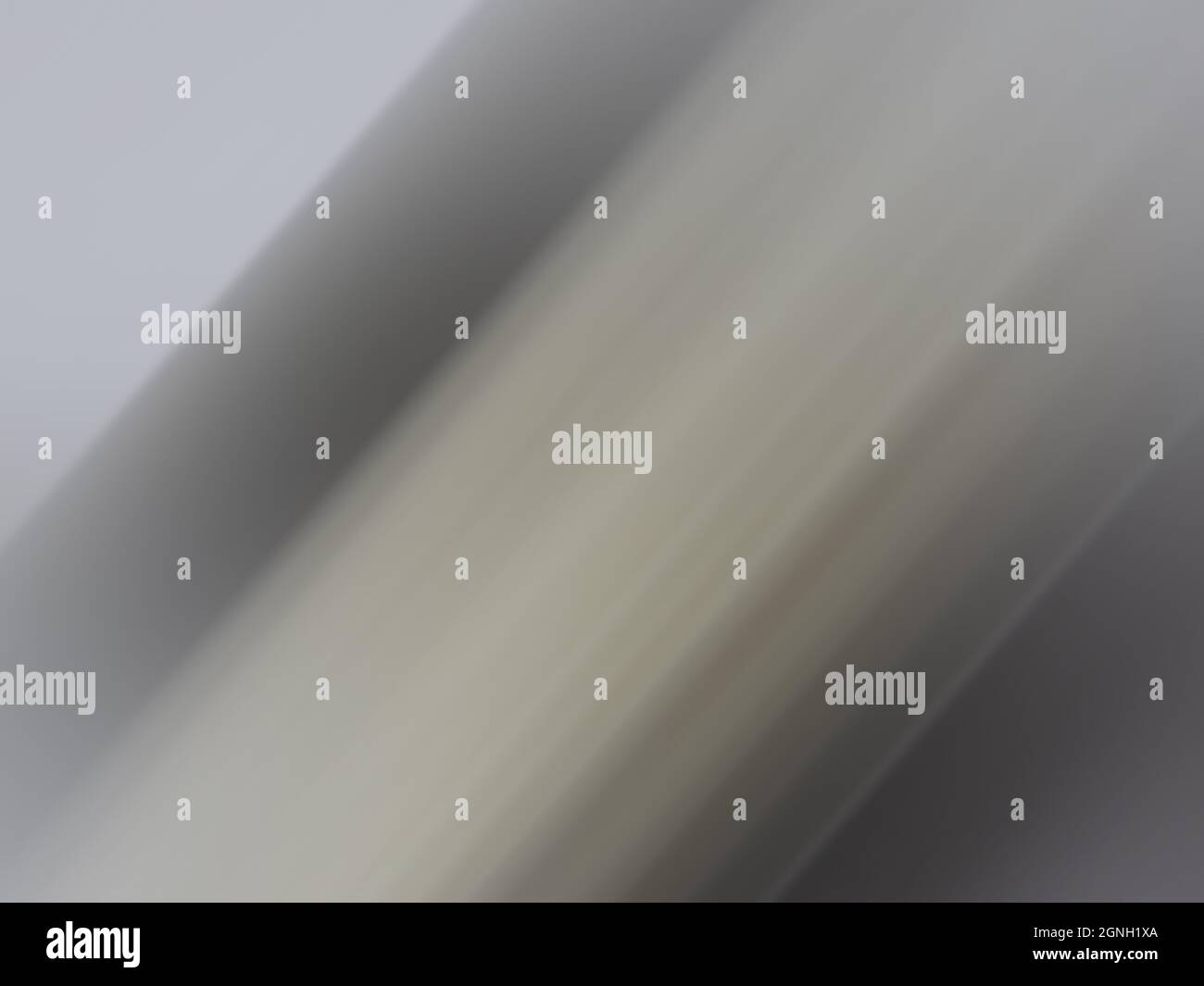 Graue, bewegungsunscharfe Oberfläche oder ein abstrakter unscharfer Hintergrund Stockfoto