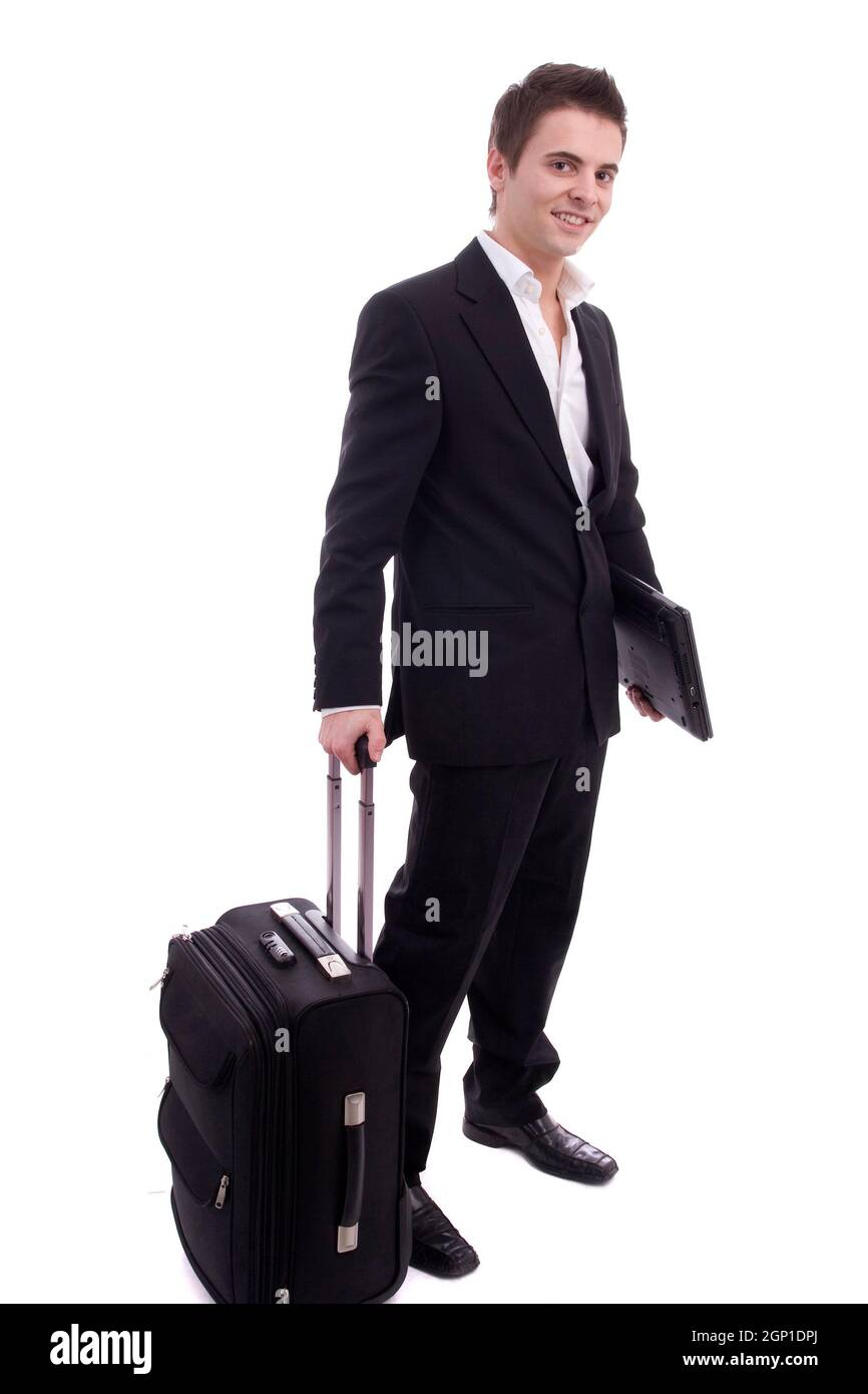 Junger Mann warten am Flughafen, isoliert auf weiß Stockfoto