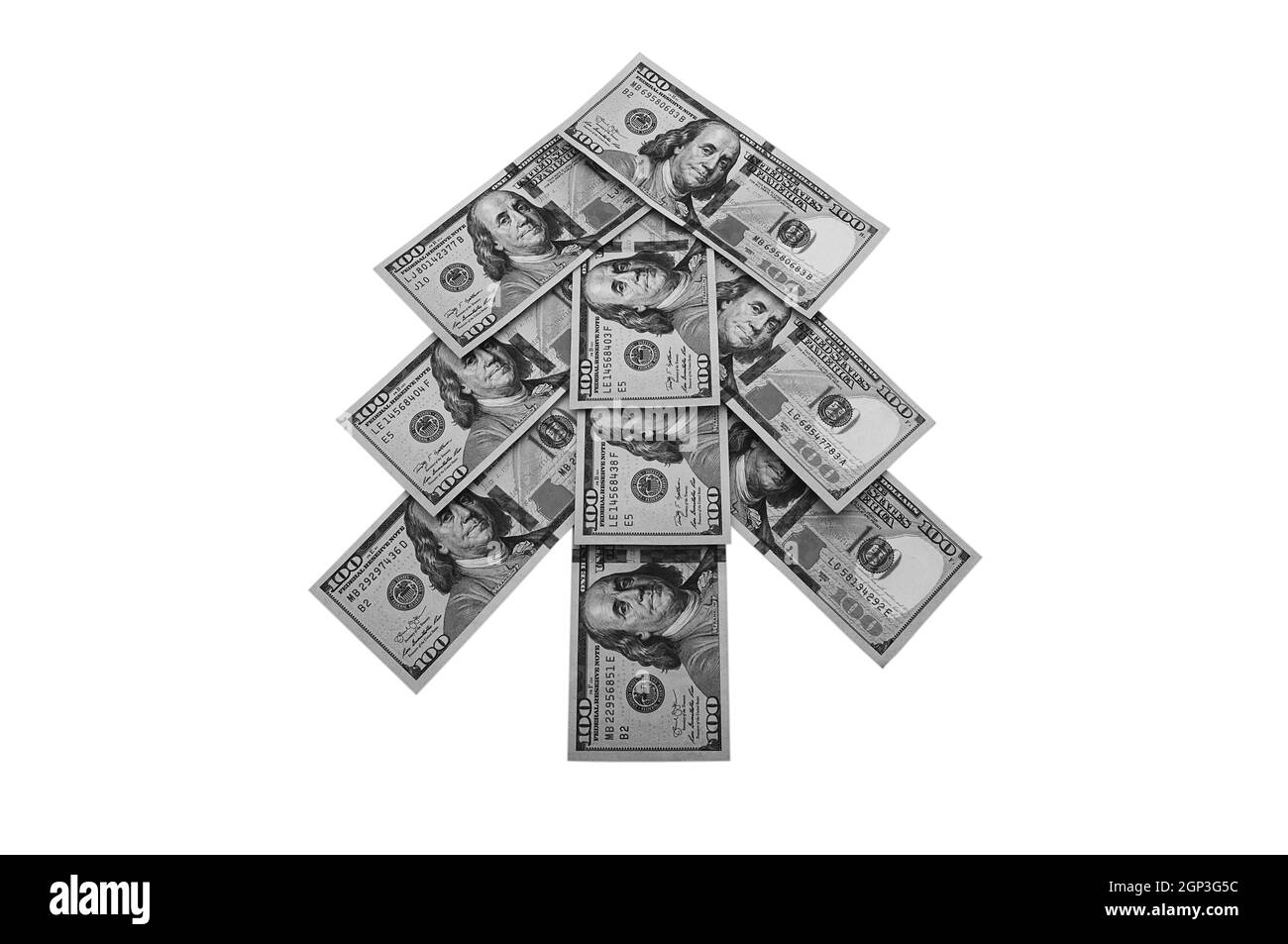 Bargeld hundert-Dollar-Scheine in Form eines Weihnachtsbaums. Isoliert auf weißem Hintergrund. Stockfoto