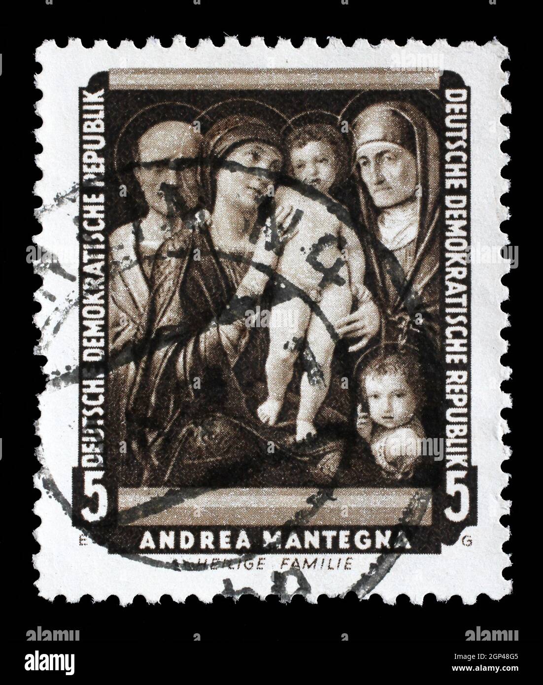 Die in der DDR gedruckte Briefmarke zeigt das Gemälde Heilige Familie von Andrea Mantegna aus der Serie berühmte Gemälde der Dresdner Galerie, um 1957. Stockfoto