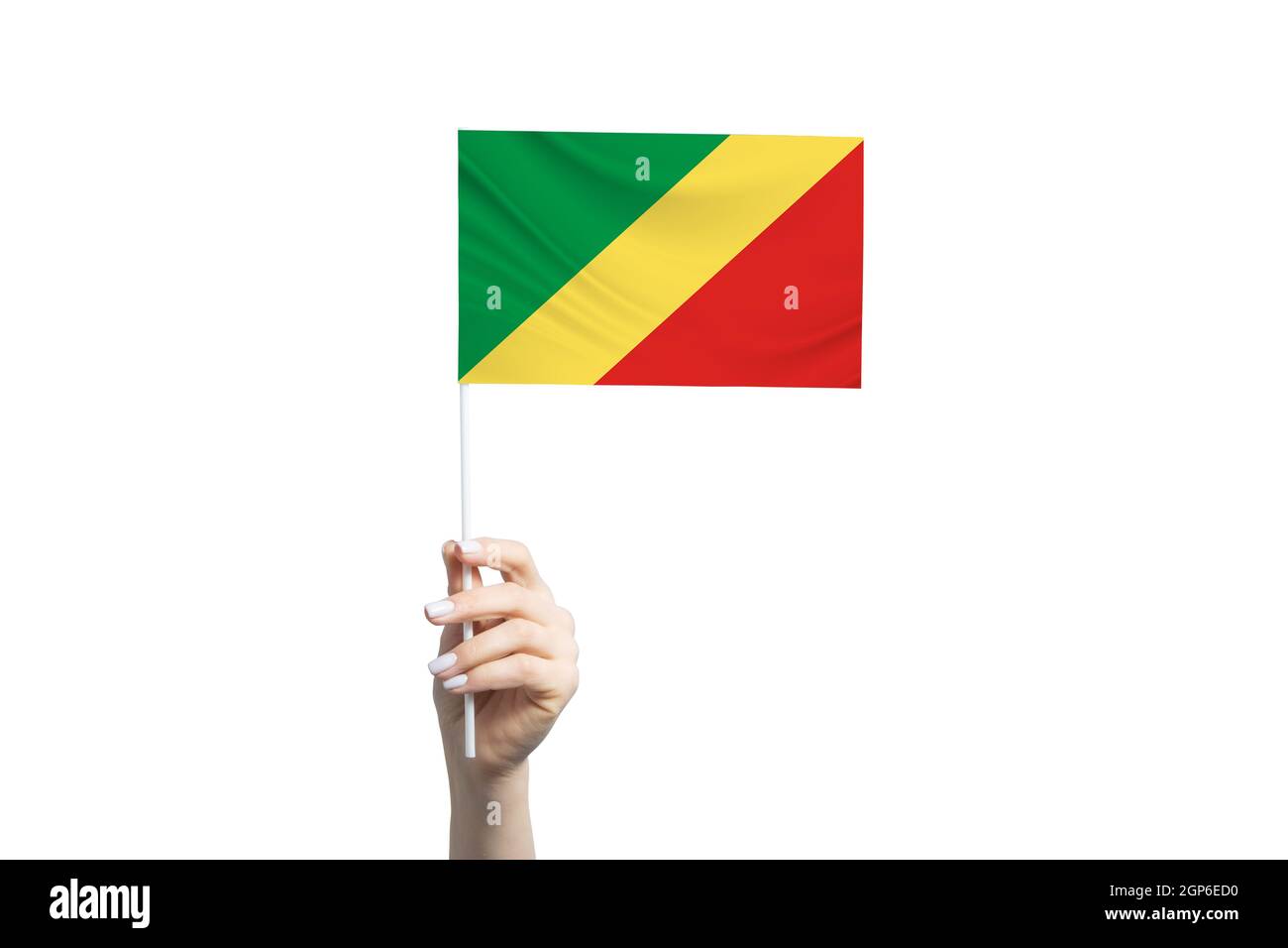 Schöne weibliche Hand halten Republik Kongo Flagge, isoliert auf weißem Hintergrund. Stockfoto