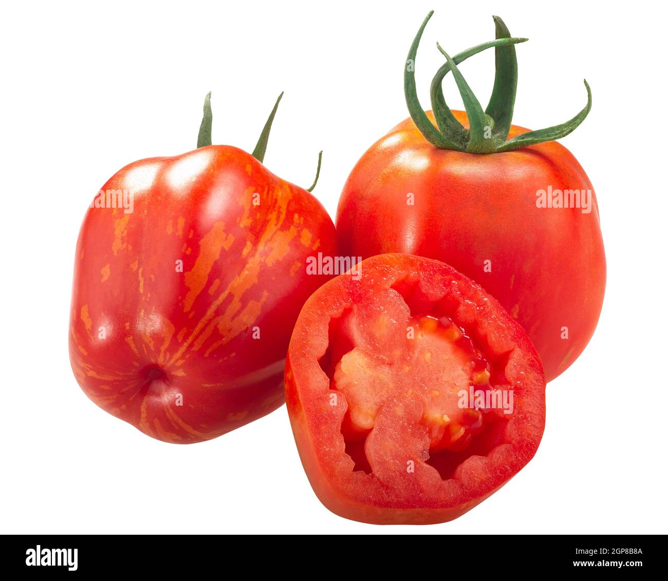 Gestreifte Stuffer Erbstück Tomaten, ganze und eine Hälfte isoliert Stockfoto