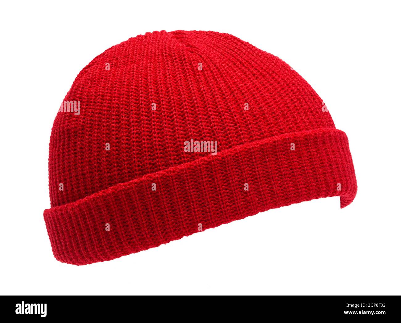 Weiße Strickmütze aus roter Wolle. Stockfoto