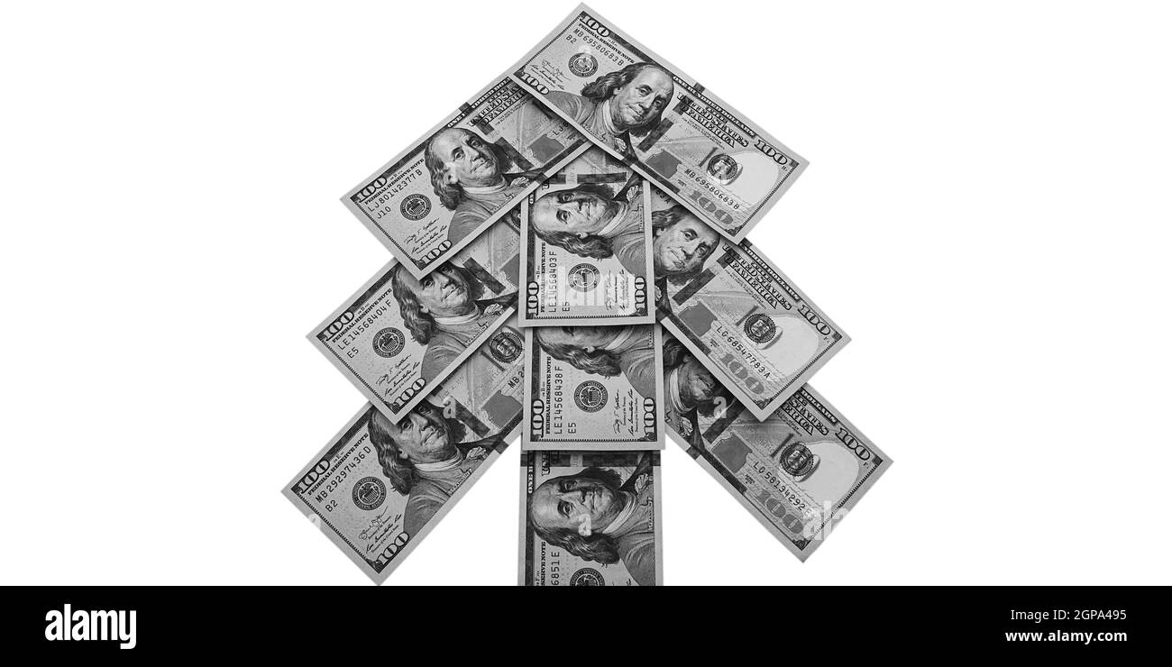 Bargeld hundert-Dollar-Scheine in Form eines Weihnachtsbaums. Isoliert auf weißem Hintergrund. Stockfoto
