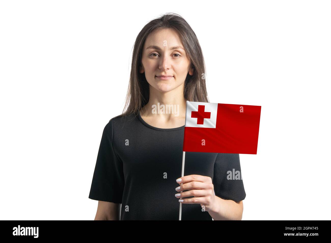 Happy junge weiße Mädchen hält Tonga Flagge isoliert auf einem weißen Hintergrund. Stockfoto