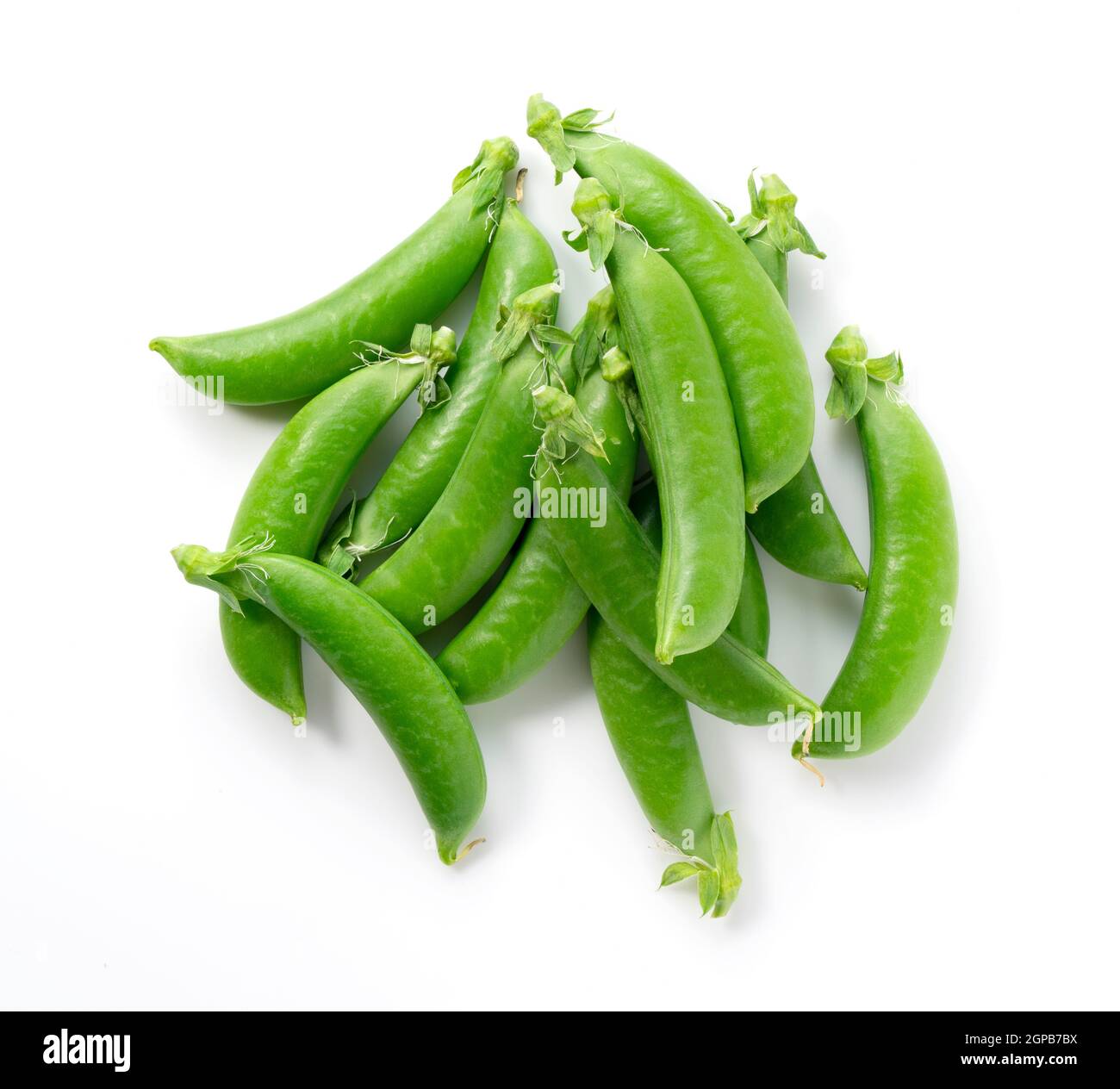 Viele Schnapperbsen auf weißem Hintergrund. Blick von oben. Stockfoto