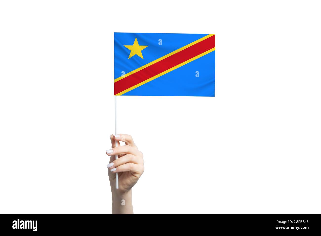 Schöne weibliche Hand hält Demokratische Republik Kongo Flagge, isoliert auf weißem Hintergrund. Stockfoto
