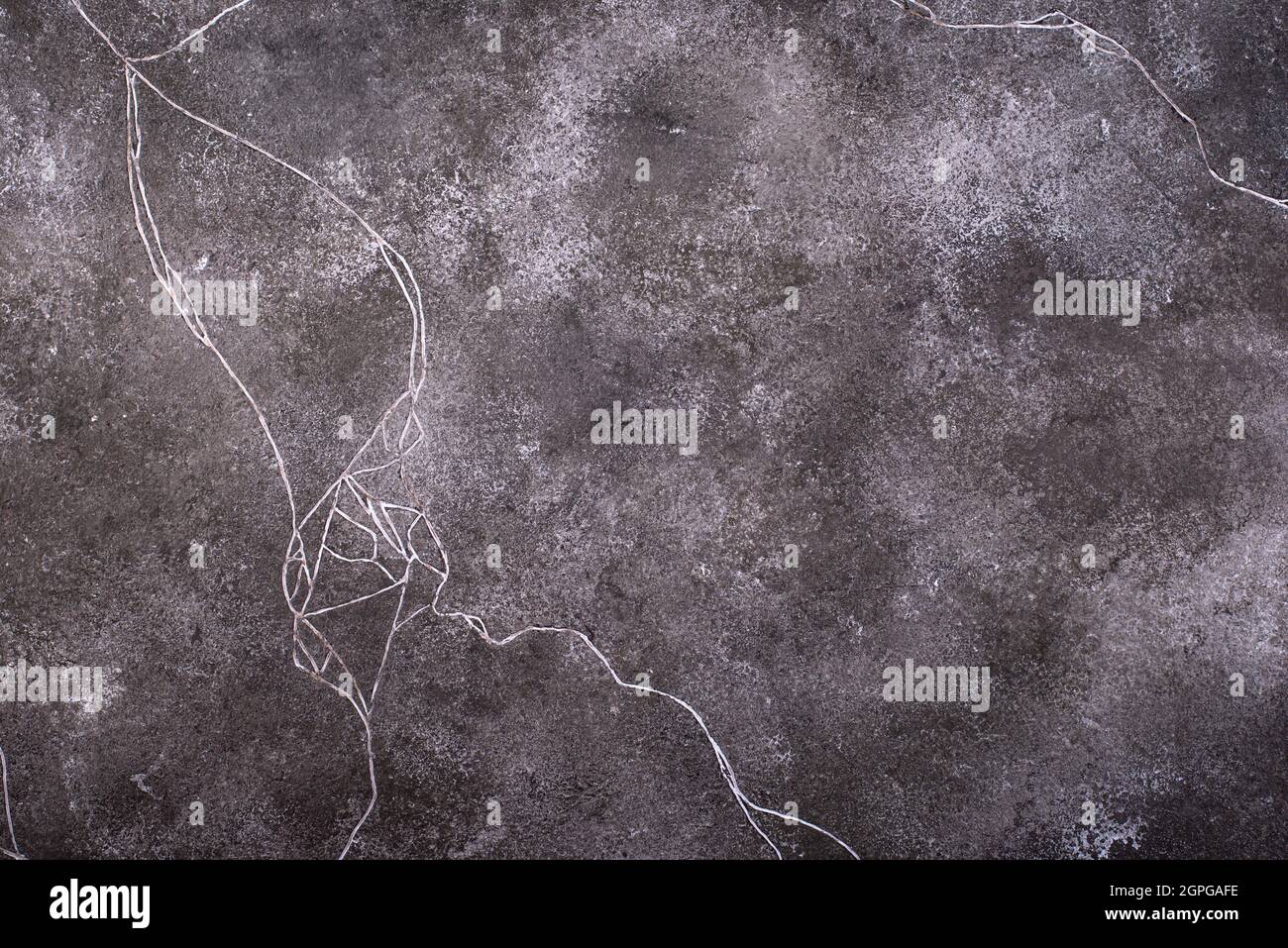 Dunkler abstrakter Beton knistert Hintergrund Stockfoto
