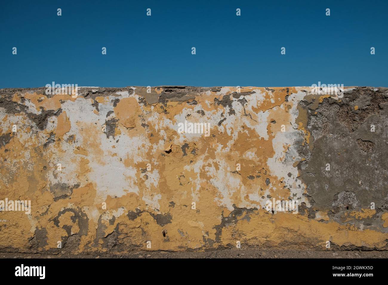 Alte Wandstruktur, Vintage Hintergrund mit verblassendem Gips Stockfoto