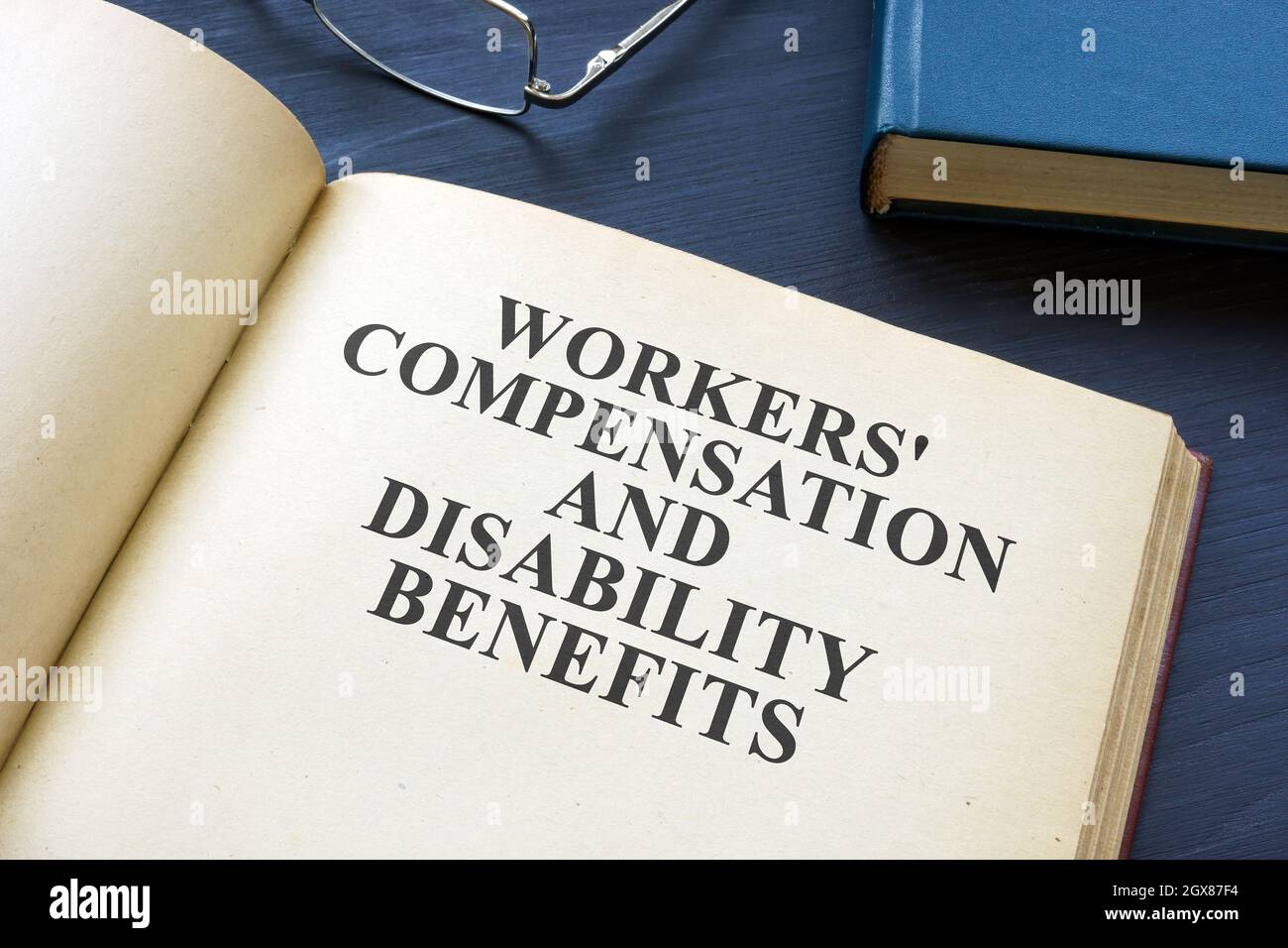 Open Workers Compensation and Disability Benefits Law Book. Stockfoto